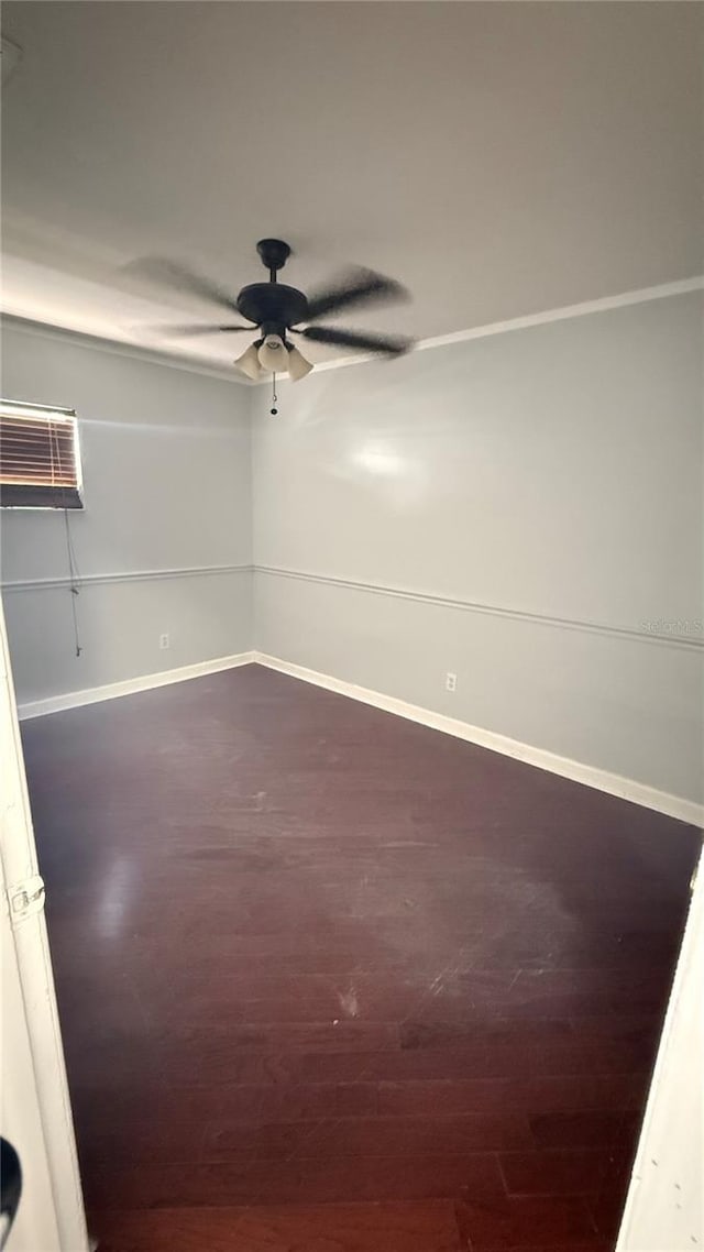 7017 Baywood Dr, Tampa, FL 33637 - unfurnished room featuring a wall mounted air conditioner, dark wood-type flooring, baseboards, and a ceiling fan