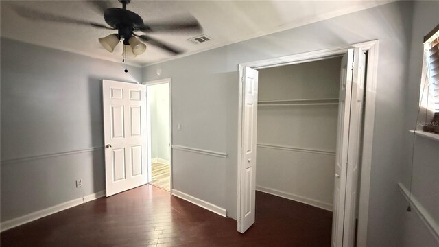 7017 Baywood Dr, Tampa, FL 33637 - unfurnished bedroom featuring a closet, wood finished floors, visible vents, ceiling fan, and baseboards