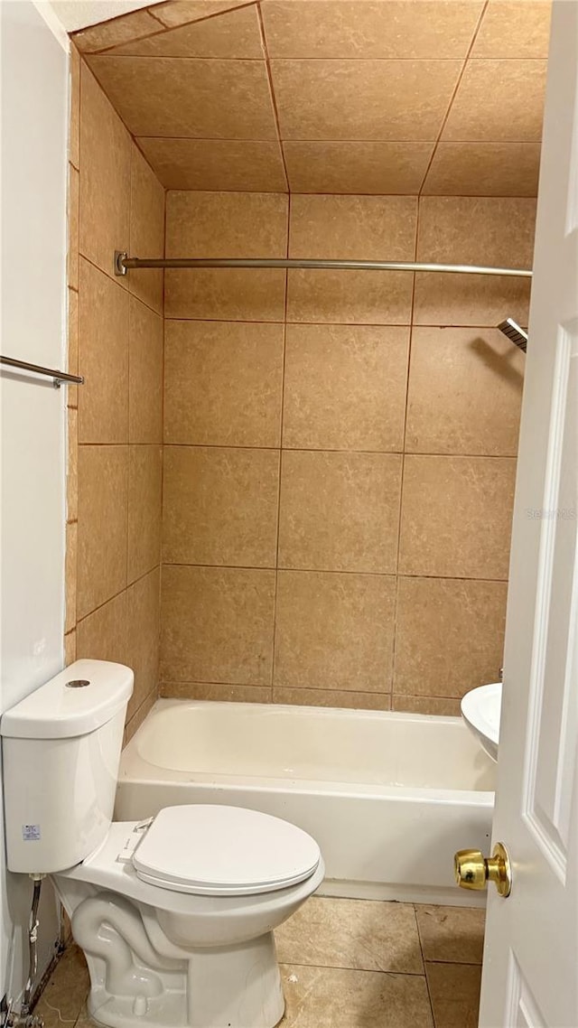 7017 Baywood Dr, Tampa, FL 33637 - bathroom featuring tile patterned flooring, toilet, and bathtub / shower combination