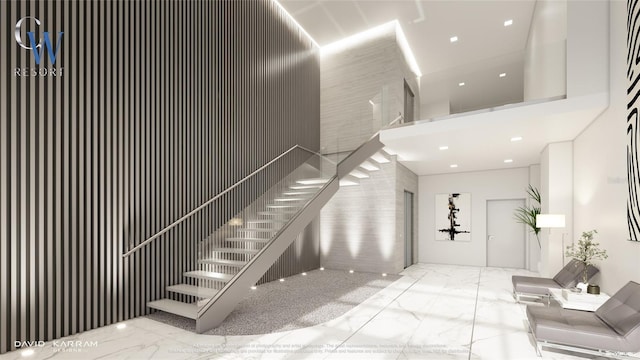 411 E Shore Dr Unit 212, Clearwater Beach, FL 33767 - stairway featuring a towering ceiling and marble finish floor