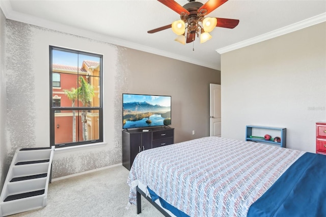 bedroom featuring ornamental molding, carpet, and a ceiling fan