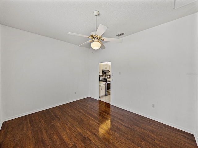 empty room with visible vents, ceiling fan, light wood-style flooring, and baseboards
