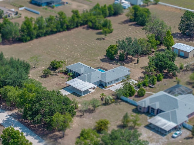 birds eye view of property with a rural view