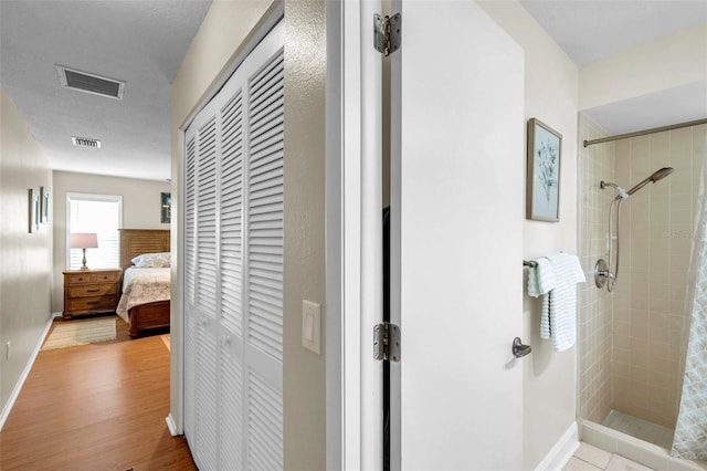 9335 Stonewall, New Port Richey, FL 34655 - corridor featuring wood finished floors and baseboards