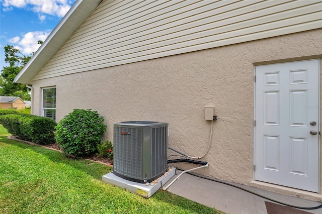 9335 Stonewall, New Port Richey, FL 34655 - exterior view of cooling unit and stucco siding