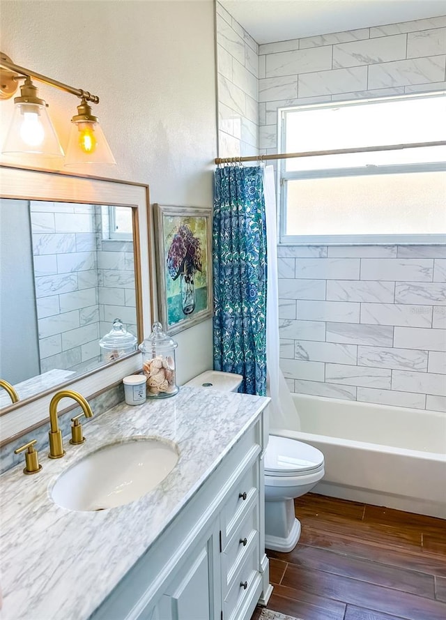 full bathroom with toilet, vanity, shower / tub combo with curtain, and wood finished floors