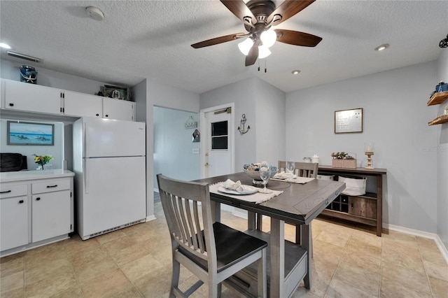 1349 New Bedford Dr Unit 6, Sun City Center, FL 33573 - dining area featuring a textured ceiling, a ceiling fan, baseboards, and recessed lighting