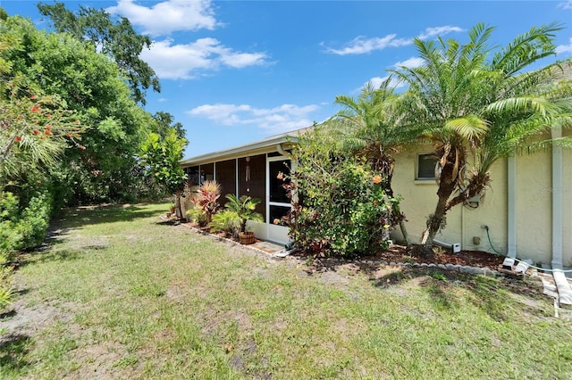 1349 New Bedford Dr Unit 6, Sun City Center, FL 33573 - view of grassy yard featuring a sunroom