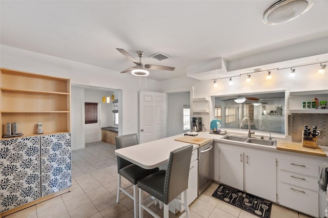 kitchen with a ceiling fan, visible vents, open shelves, a sink, and light countertops