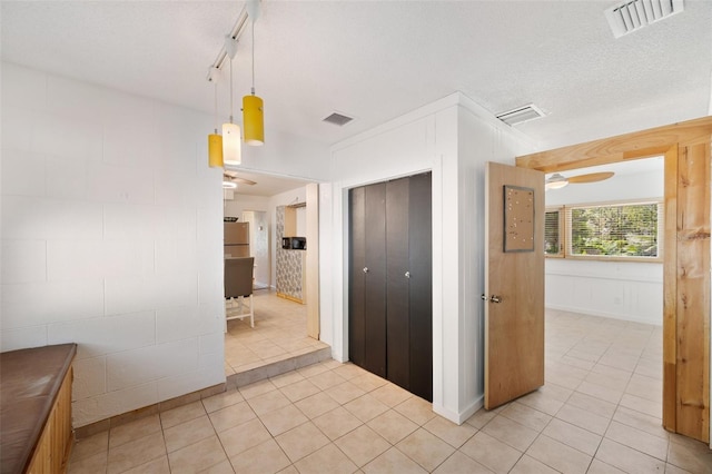 interior space featuring visible vents and light tile patterned flooring
