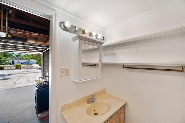 bathroom with concrete flooring and vanity