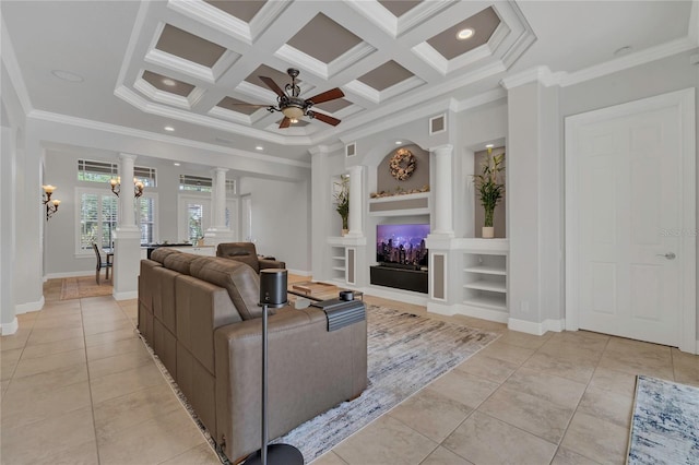 living room with crown molding, decorative columns, and ceiling fan