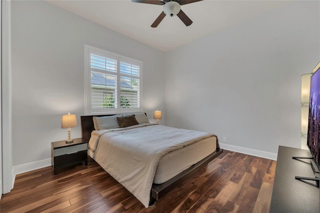 bedroom featuring baseboards, a ceiling fan, and wood finished floors