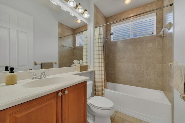 full bathroom featuring vanity, tile patterned flooring, toilet, and shower / tub combo