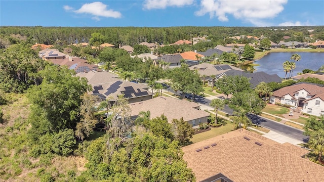 birds eye view of property featuring a water view and a residential view