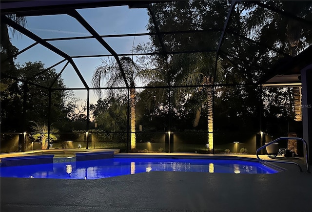 20632 Broadwater Dr, Land O Lakes, FL 34638 - pool at dusk with an outdoor pool, a patio area, and glass enclosure
