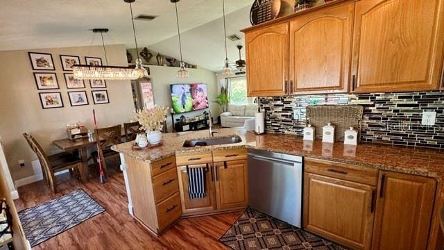 150 Tompkins St, Port Charlotte, FL 33954 - kitchen with a sink, dark wood-type flooring, a peninsula, stainless steel dishwasher, and lofted ceiling
