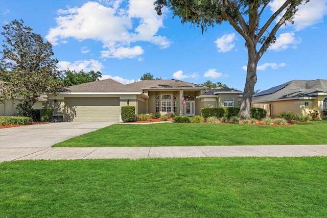 prairie-style house featuring concrete driveway, an attached garage, a front yard, and stucco siding