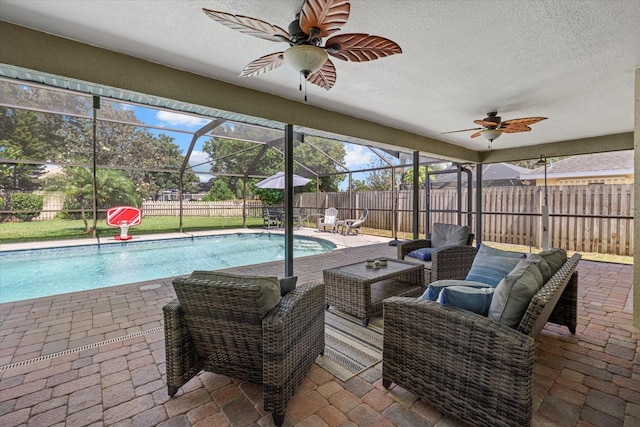 view of pool featuring ceiling fan, a fenced in pool, a fenced backyard, and a patio area