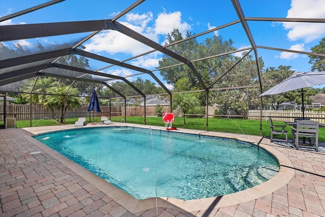 view of pool with a fenced in pool, a fenced backyard, a patio area, glass enclosure, and a yard