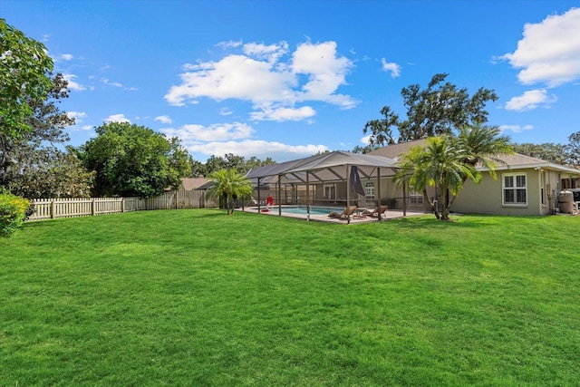 view of yard with a patio, a fenced in pool, a lanai, and a fenced backyard