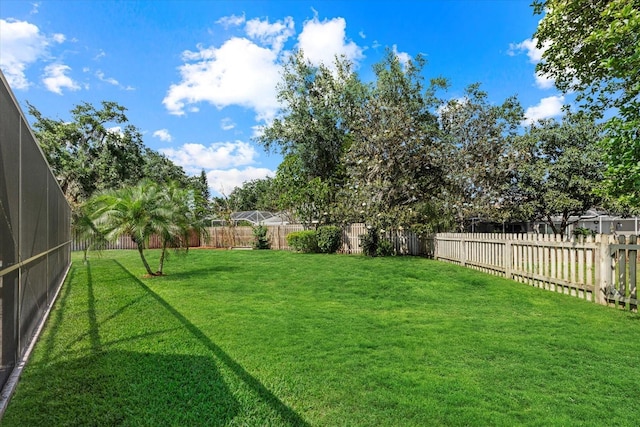 view of yard featuring a fenced backyard