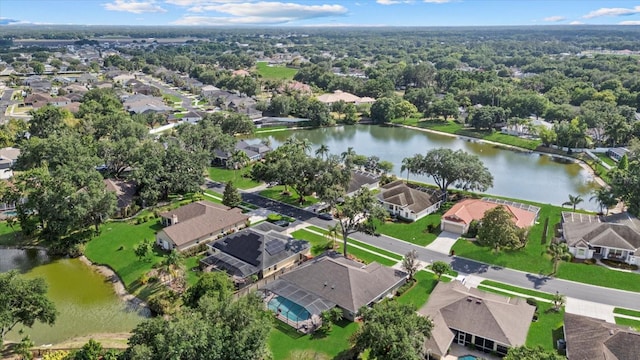 bird's eye view with a residential view and a water view