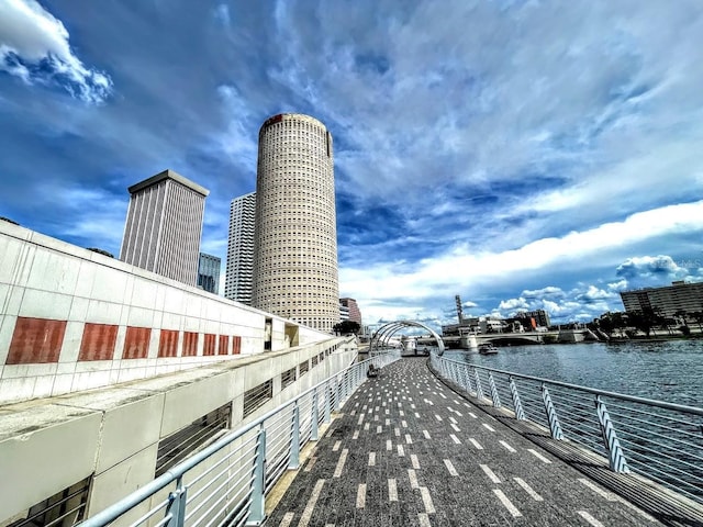 exterior space with a water view and a city view