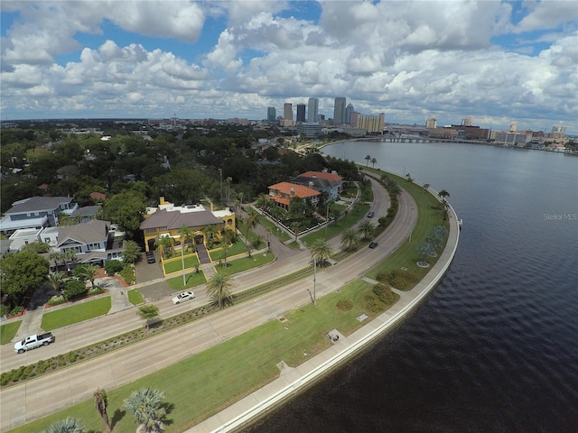 drone / aerial view with a city view and a water view