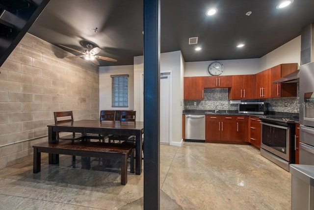 5008 S Macdill Ave Unit 10, Tampa, FL 33611 - kitchen with a sink, ceiling fan, dark countertops, finished concrete flooring, and appliances with stainless steel finishes