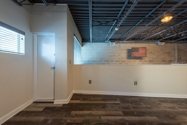 5008 S Macdill Ave Unit 10, Tampa, FL 33611 - below grade area with dark wood-type flooring and baseboards