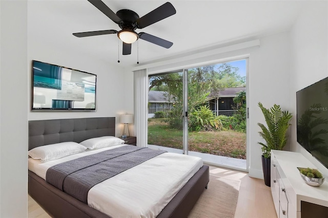 12601 Stone House Loop, Hudson, FL 34667 - bedroom featuring a ceiling fan, multiple windows, and light wood-style floors