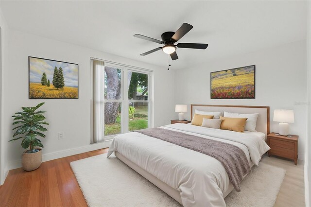 12601 Stone House Loop, Hudson, FL 34667 - bedroom featuring light wood-style floors, baseboards, and a ceiling fan