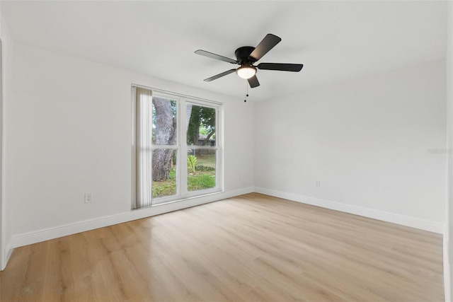 12601 Stone House Loop, Hudson, FL 34667 - unfurnished room featuring baseboards, ceiling fan, and light wood-style flooring