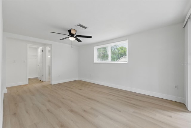 12601 Stone House Loop, Hudson, FL 34667 - unfurnished bedroom featuring a closet, baseboards, visible vents, and light wood-type flooring
