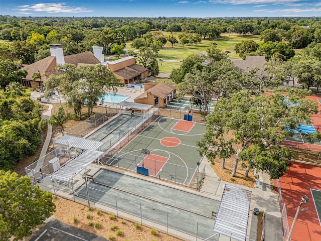 12601 Stone House Loop, Hudson, FL 34667 - view of sport court featuring fence, community basketball court, and view of golf course