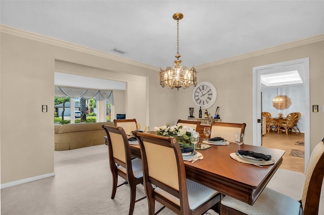 dining area with an inviting chandelier, ornamental molding, and baseboards