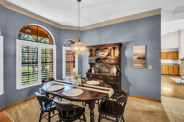 10 Greenhaven Cir, Oldsmar, FL 34677 - dining room featuring baseboards, a chandelier, ornamental molding, a high ceiling, and light tile patterned floors