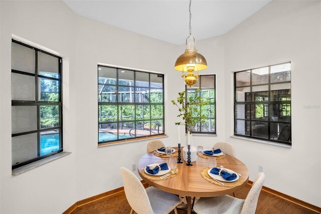 10 Greenhaven Cir, Oldsmar, FL 34677 - dining area with baseboards, healthy amount of natural light, and wood finished floors