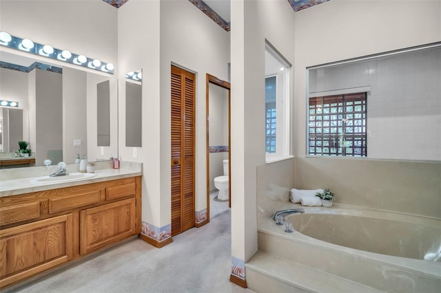 10 Greenhaven Cir, Oldsmar, FL 34677 - bathroom with a garden tub, vanity, toilet, and a closet