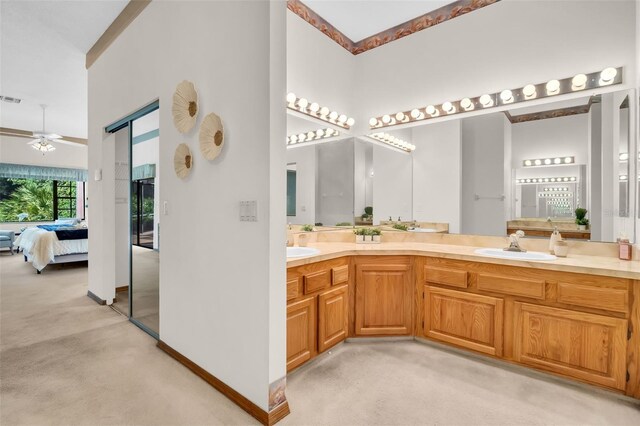 10 Greenhaven Cir, Oldsmar, FL 34677 - ensuite bathroom featuring a high ceiling, ceiling fan, double vanity, and baseboards