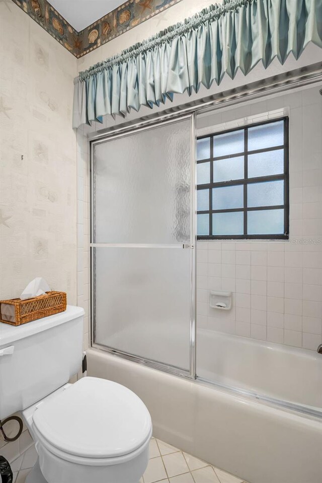 10 Greenhaven Cir, Oldsmar, FL 34677 - bathroom featuring tile patterned floors, enclosed tub / shower combo, and toilet