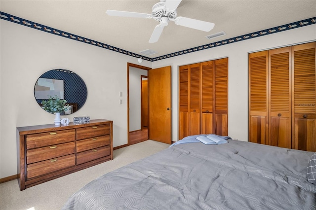 10 Greenhaven Cir, Oldsmar, FL 34677 - bedroom with carpet, multiple closets, ceiling fan, and baseboards