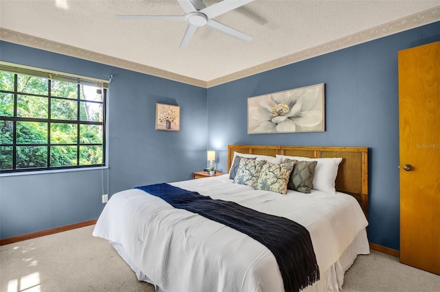 10 Greenhaven Cir, Oldsmar, FL 34677 - bedroom with a textured ceiling, carpet floors, baseboards, and a ceiling fan