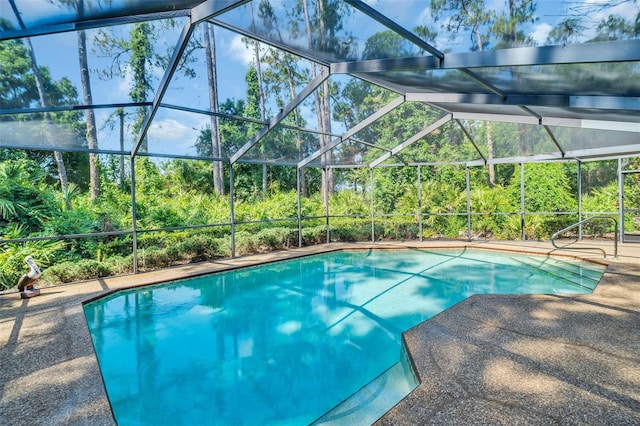 10 Greenhaven Cir, Oldsmar, FL 34677 - outdoor pool featuring glass enclosure and a patio area