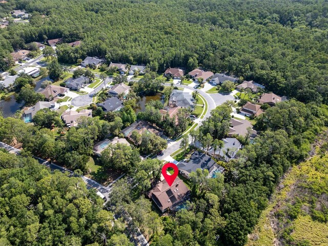10 Greenhaven Cir, Oldsmar, FL 34677 - aerial view of property and surrounding area featuring a heavily wooded area and nearby suburban area