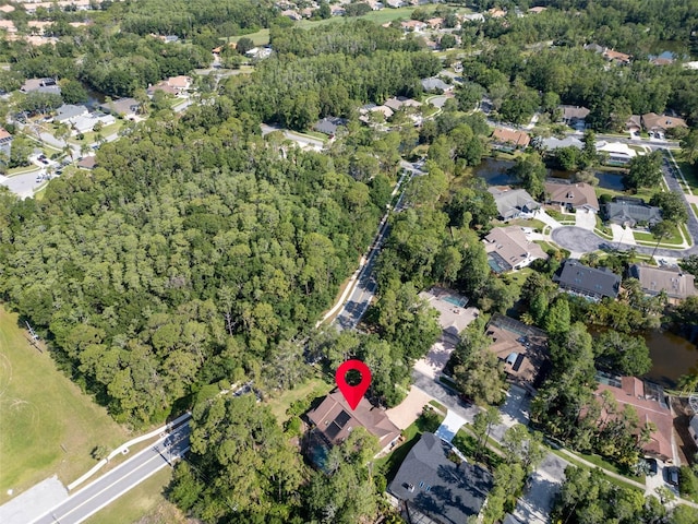 10 Greenhaven Cir, Oldsmar, FL 34677 - aerial view of property's location with nearby suburban area and a heavily wooded area