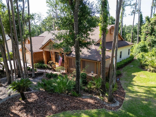 10 Greenhaven Cir, Oldsmar, FL 34677 - obstructed view of property featuring a front yard and a shingled roof