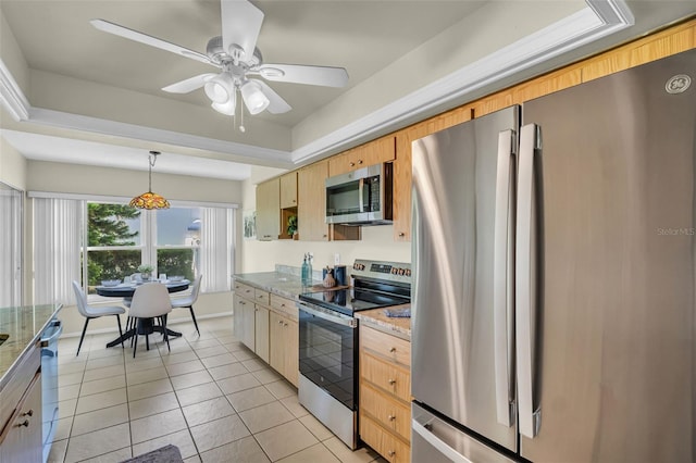 kitchen featuring stainless steel appliances, light tile patterned floors, ceiling fan, light stone countertops, and decorative light fixtures