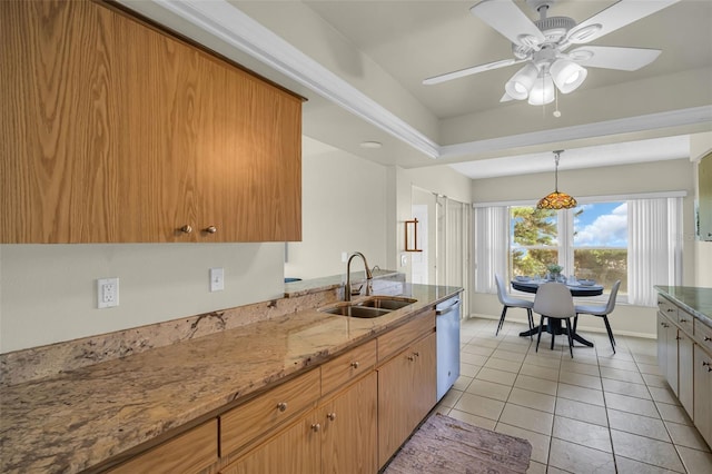 kitchen with a sink, dishwasher, light tile patterned flooring, a ceiling fan, and light stone countertops